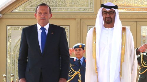 Prime Minister Tony Abbott is welcomed by the Crown Prince of Abu Dhabi at the Al Mushrif Palace in Dubai. (AAP)