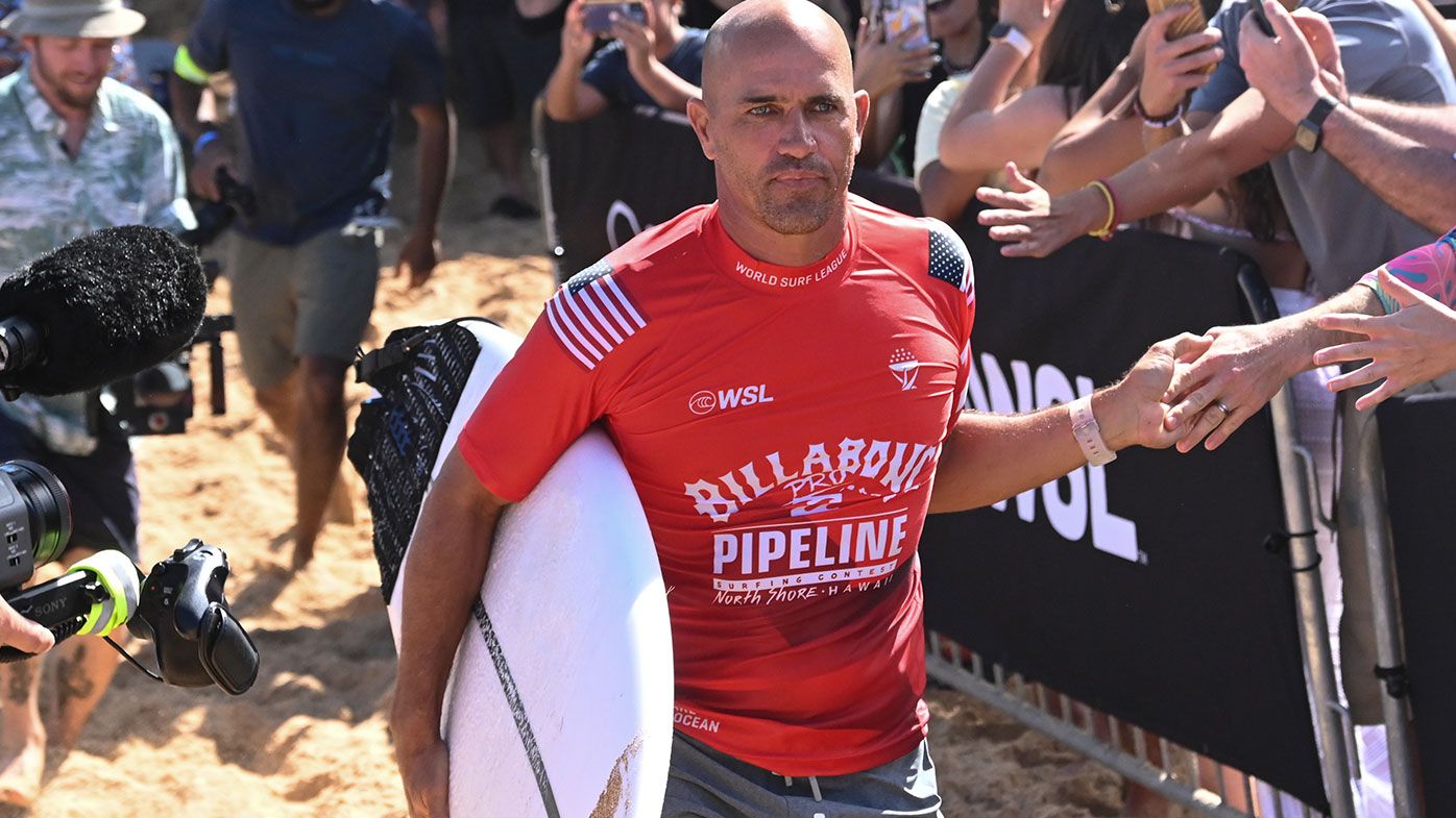 Surfing legend Kelly Slater confirms plans to attend Australia amid vaccination mystery