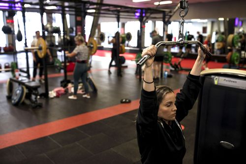 People work out at the Fitness First Gym at Bondi Junction, Sydney