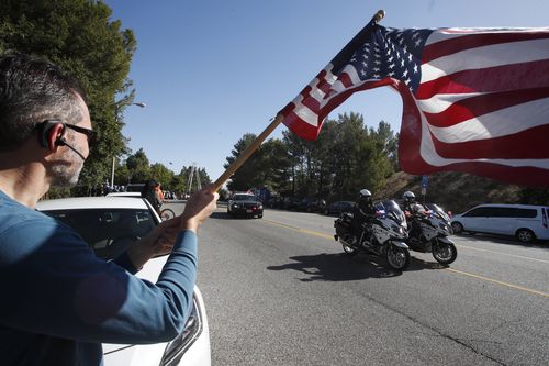 Hundreds of mourners gathered on the streets to pay respects to the fallen victims.