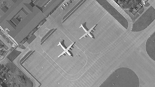Satellite image of Woody Island in the Paracel island chain in the South China Sea taken in November 2017 shows two Chinese Y-8 military transport aircraft.  The Washington-based Asia Maritime Transparency Initiative says China has undertaken new deployments of military aircraft to the island in recent weeks.  Major construction work took place at other outposts in the disputed South China Sea during 2017. 