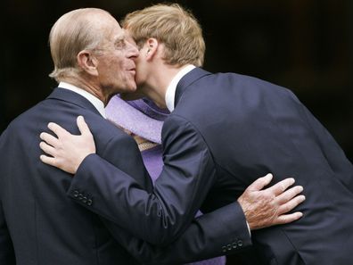 Prince Philip kisses grandson Prince William.