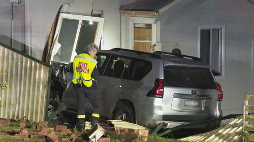 Car crashes into side of Guildford home where woman was sleeping.