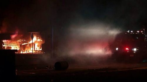 Properties are ablaze as riots continue in Ferguson, Missouri. (Twitter/@Dr_Dennie)