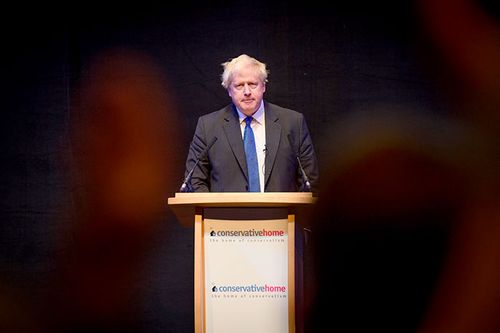 Boris Johnson presents at the Conservative Party conference in Birmingham.