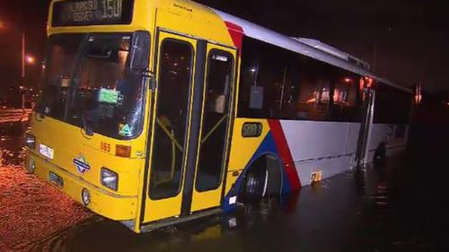 A bus became stuck due to flooding in Adelaide. (9NEWS)