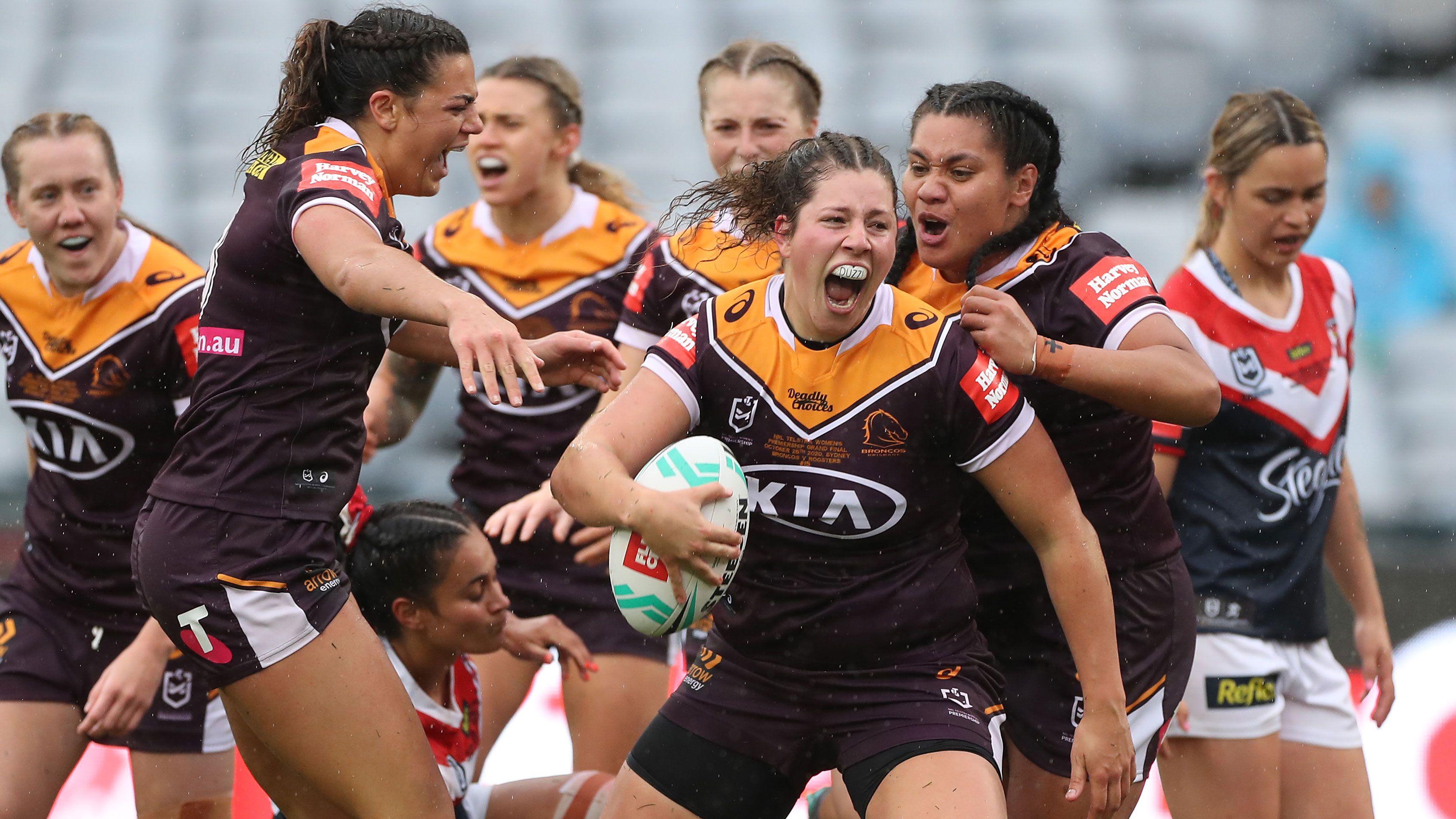 Chelsea Lenarduzzi of the Broncos celebrates with teammates after scoring a try during the 2020 NRLW Grand Final.
