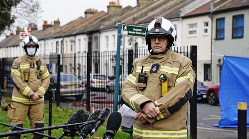 Firefighters at the scene in Sutton, south London, where four children have died following a fire at a house. Picture date: Thursday December 16, 2021. PA Photo. See PA story FIRE Sutton. Photo credit should read: Kirsty O'Connor/PA Wire