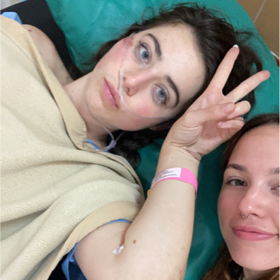 Jordon Hunt (left) in hospital after a scooter accident in Bali.