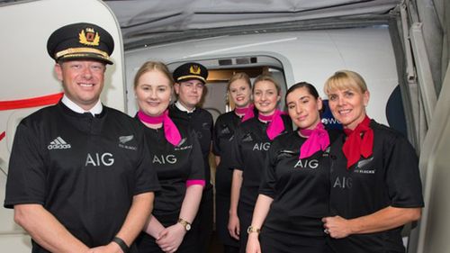 Qantas crew wears All Blacks jerseys after losing Rugby World Cup bet to Air New Zealand