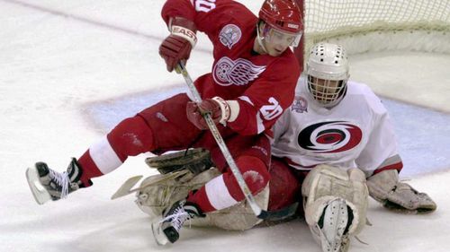 Luc Robitaille (left) playing in the 2002 Stanley Cup for the Detroit Red Wings. (AAP)