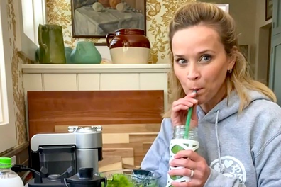 Reese Witherspoon drinking a green smoothie