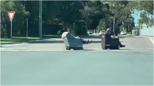 Two men were filmed riding motorised lounge chairs through the streets of Newcastle.