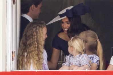 Meghan Markle with Savannah Phillips and Mia Tindall in the office of Major General with a view of The Trooping of the Color at the Horse Guard Parade.