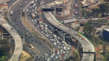 A woman has died and a man is in hospital following a collision between a car and a truck on Melbourne&#x27;s West Gate Freeway.