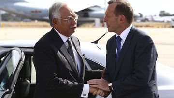 In this April 3, 2014, file photo, Australian then Prime Minister Tony Abbott, right, shakes hands with Malaysian then Prime Minister Najib Razak as Razak prepares to depart Australia after his visit during the search of the missing Malaysia Airlines flight MH370 at Perth International Airport, Australia. Abbott has claimed the &quot;top levels&quot; of the Malaysian government long suspected the vanishing of a plane almost six years ago was a mass murder-suicide by the pilot. 