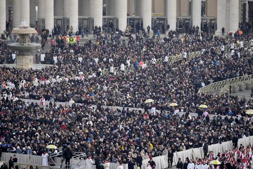 VATICAN CITY, VATICAN - JANUARY 05: Mourners attend the funeral mass for Pope Emeritus Benedict XVI at St. Peter's square on January 5, 2023 in Vatican City, Vatican. Former Pope Benedict XVI, who served as head of the Catholic Church from 19 April 2005 until his resignation on 28 February 2013, died on 31 December 2022 aged 95 at the Mater Ecclesiae Monastery in Vatican City. Over 135,000 people paid their tributes on the first two days of the late pontiff's lying in state at St. Peter's Basili