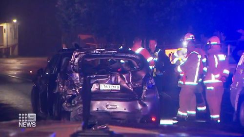 The car was left crushed after the freight train collided into it at a railway crossing in Adelaide Hills. 