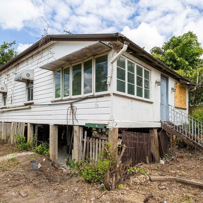 Who’d pay for a house without inspecting it? The buyer of this derelict Queenslander will have to