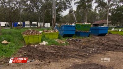 The NSW environmental watchdog and a local council have launched investigations into an apparent rubbish dump which suddenly appeared on a residential street in south-west Sydney.