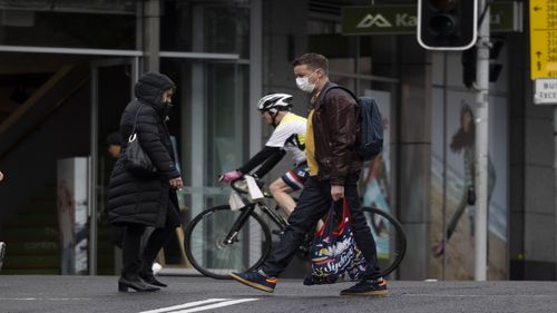 Pedestrians are seen at Bondi Junction on June 21, 2021 in Sydney, Australia. A cluster of COVID-19 cases in Sydney's eastern suburbs continues to grow, causing the government to impose restrictions including mandatory indoor mask-wearing in several jurisdictions. NSW Premier Gladys Berejiklian is urging people to get tested to stop the spread and limit further restrictions.