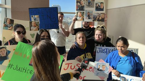 Relatives of a 4-year-old boy whose body was found in a garage freezer in Las Vegas speak with reporters at the Clark County Regional Justice Center after a court hearing for Brandon Lee Toseland on Monday, Feb. 28, 2022. The boy's grandmother, Victoria Abina, center, and aunt, Annissa Abina, right, said they want justice for the child. His father died in January 2021. Toseland is jailed on charges that he killed the boy in December and abused the boy's mother and 7-year-old sister while holding