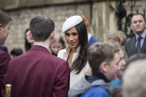 Meghan took time to engage in conversation with schoolchildren in Dean's Yard, in the Abbey surrounds. Picture: PA/AAP