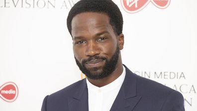 Actor Sope Dirisu poses for photographers as they arrive for the British Academy Television Awards at the Television Centre in west London, Friday, July 31, 2020.