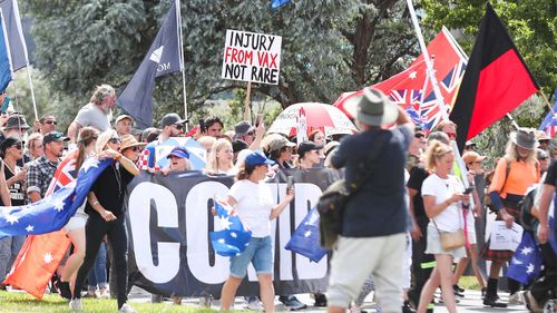 Protesters from the 'Convoy to Canberra' march from Glebe Park towards the Parliamentary triangle in Canberra.