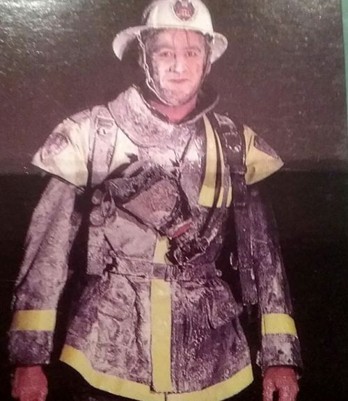 A firefighter covered in foam. (Photo: Supplied).