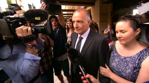 Flanked by supporters, Mr Keogh walked free from court. (9NEWS)