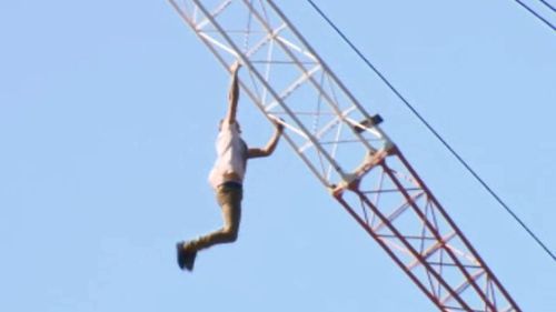 A man climbed a crane in a Woolloongabba construction site. (9NEWS)