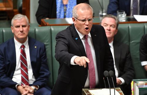 Prime Minister Scott Morrison clashes with Bill Shorten during Question Time in Canberra.