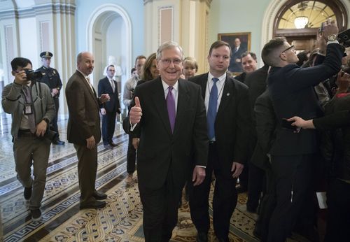 Senate Majority Leader Mitch McConnell gives the thumbs up as he walks off the Senate floor. (AAP)