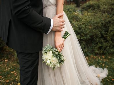 Bride holding flowers at wedding