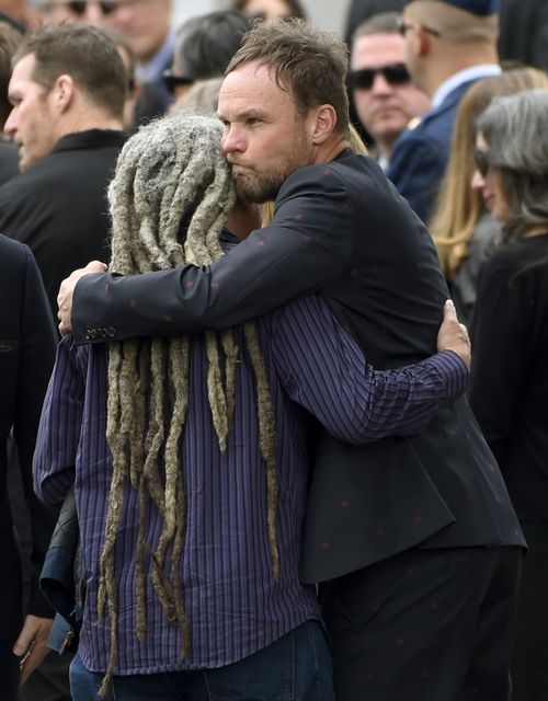 Jeff Ament, pictured hugging a guest at a funeral for Soundgarden's Chris Cornell in Los Angeles in May, is unapologetic about the poster. 