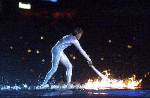 Australian icon Cathy Freeman ignites the Olympic flame during the opening ceremony for the Summer Olympics at Olympic Stadium in Sydney.