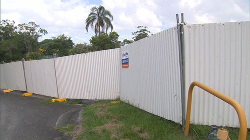 A white perimeter fence was set up by the state government about two weeks ago. (9NEWS)