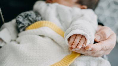 Woman holding baby boy