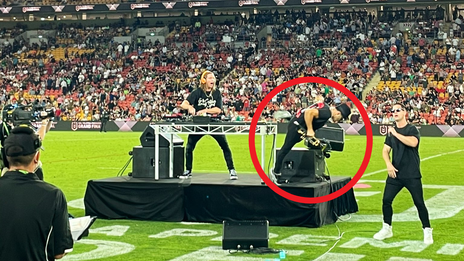 Timmy Trumpet takes a tumble off the stage.