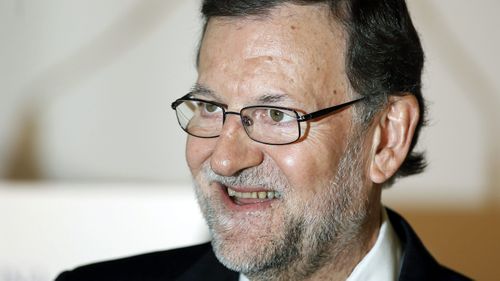 Rajoy makes his first public appearance the day after he was attacked. (AAP)