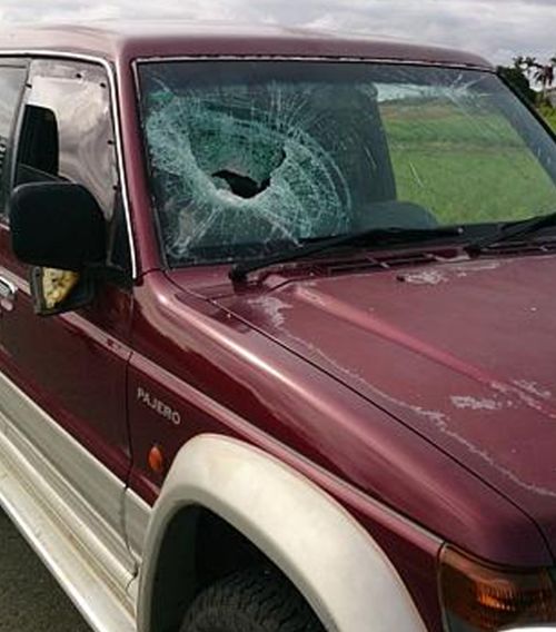 A rock smashed through the windscreen.