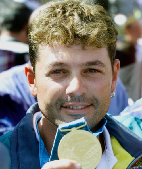 Michael Diamond with the Olympic gold medal he won in 2000. (AAP)