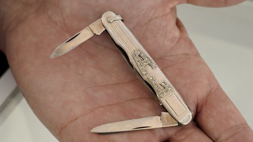 A platinum and diamond pocket knife with the name AL in diamonds that once belonged to mob boss Al Capone is seen on display at Witherell's Auction House in Sacramento, Calif., Wednesday, Aug. 25, 2021. The knife is among the 174 family heirlooms that will be up for sale at an Oct. 8 auction titled "A Century of Notoriety: The Estate of Al Capone," that will be held by Witherell's in Sacramento. (AP Photo/Rich Pedroncelli)