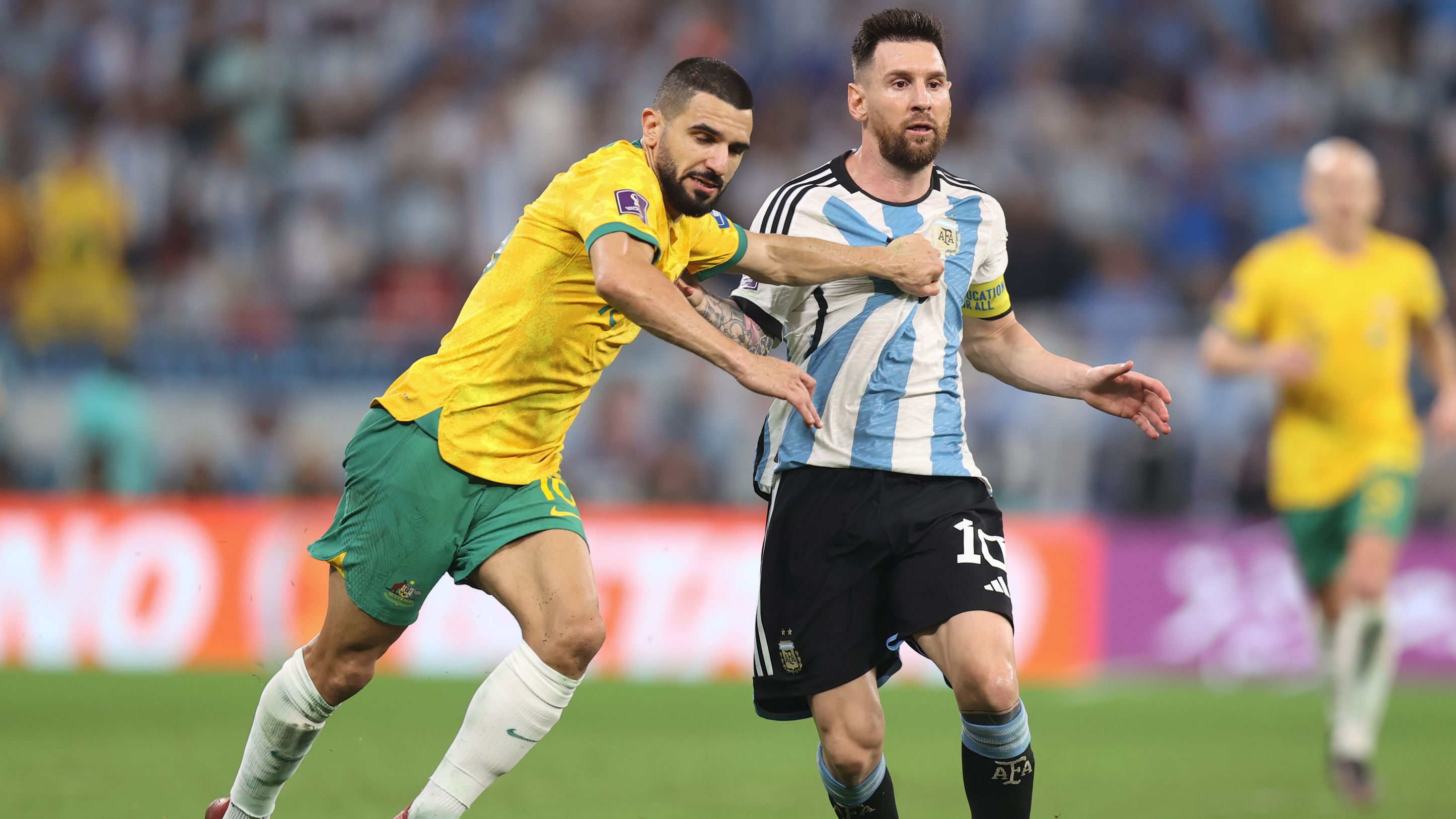 Aziz Behich of Australia and Lionel Messi of Argentina scuffle during the FIFA World Cup round of 16 match. (Photo by Charlotte Wilson/Offside/Offside via Getty Images)