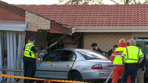 The car slammed into the lounge room of a house where two children were inside. (9NEWS)