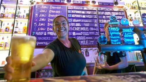 A bartender pours a drink at Six Tanks Brewery on Mitchell St in Darwin on May 15