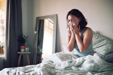 Woman in bed with flu