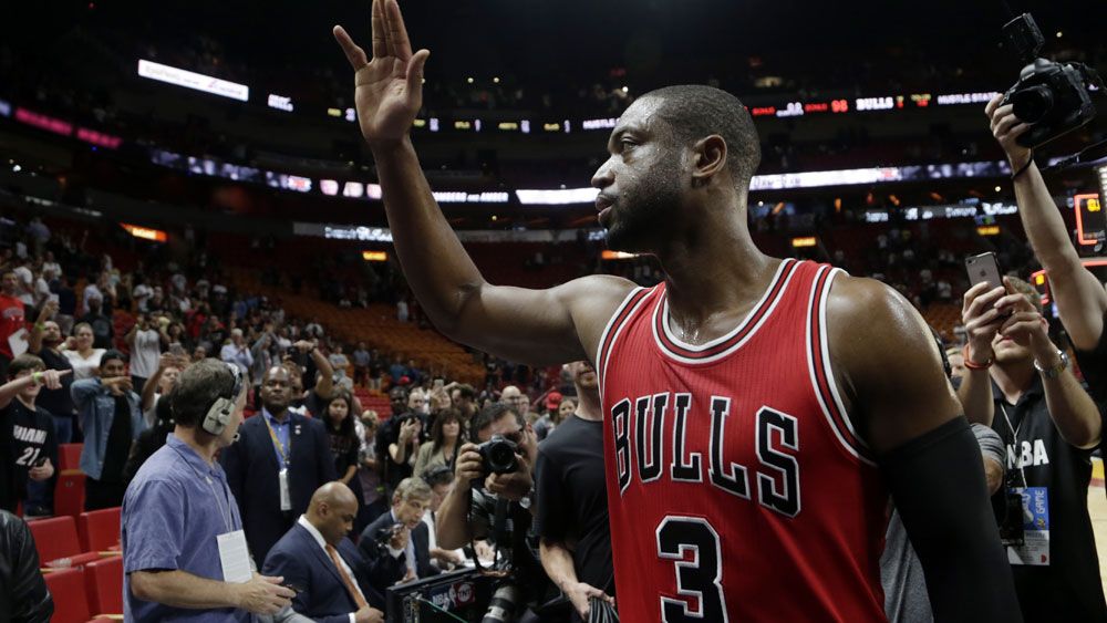Dwayne Wade greets fans from his former team the Miami Heat after the Bulls three point victory.(AAP)