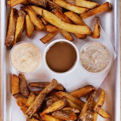Fries at Patate UK served with (L-R) Signature Sauce, homemade jus and black pepper mayo